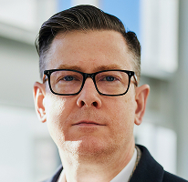 Foto profil Alexander Hughes, eksekutif CEO dari perusahaan crypto trading